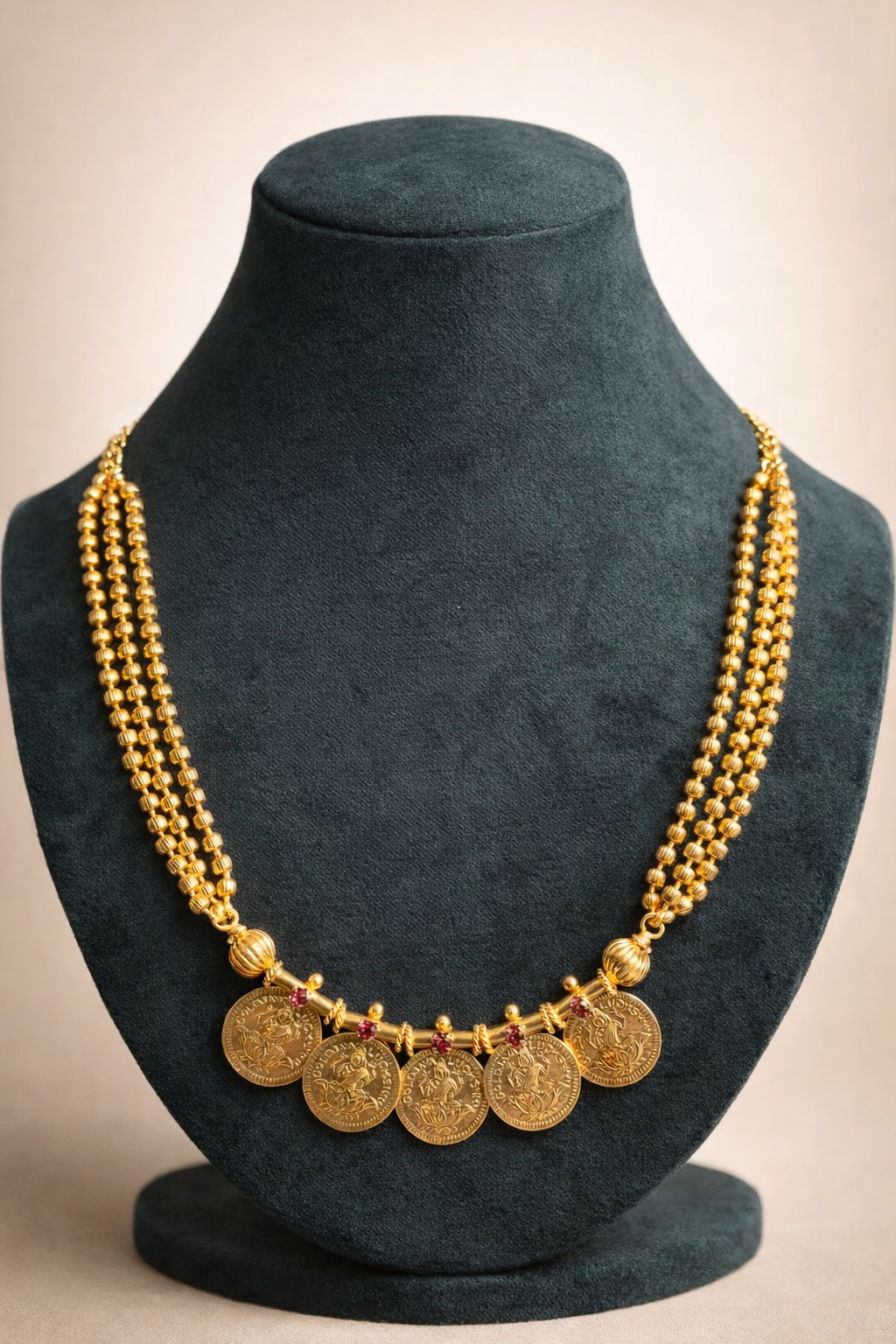 Mid-length Five Lakshmi Coin Kasumala Necklace – traditional South Indian temple jewellery with Lakshmi coin pendants and multi-strand gold-tone bead chain displayed on a mannequin