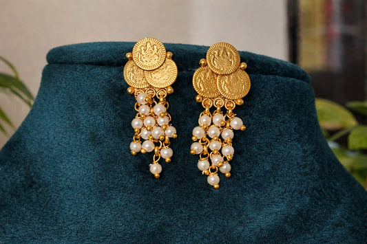 Lakshmi coin temple earrings with traditional gold-tone coin motifs and cascading pearl-like bead drops.