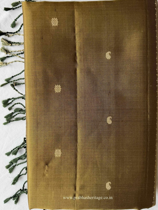 Folded antique olive-gold Kanchipuram silk saree with manga and floral buttas and bottle-green border