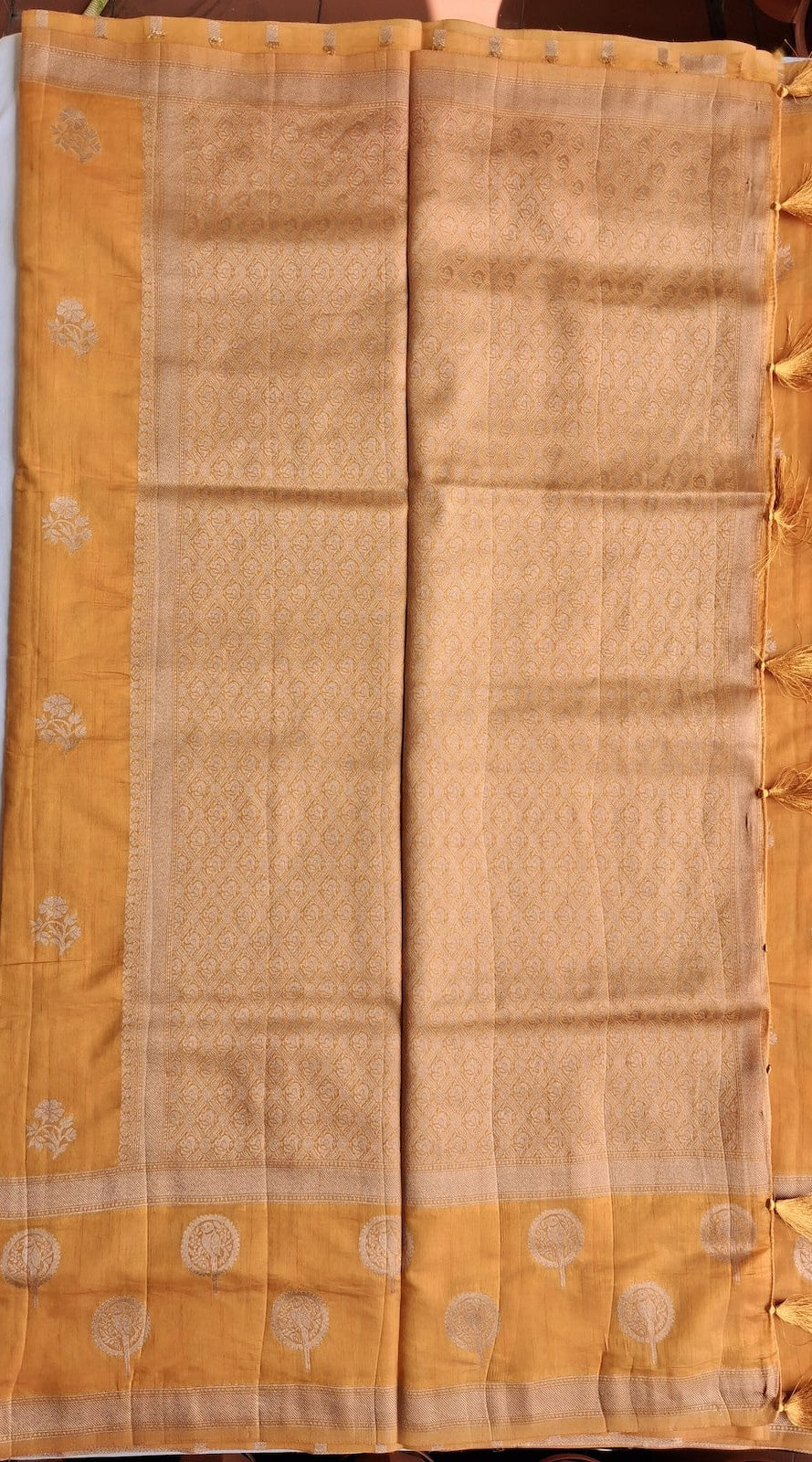 Parrot Kili medallion zari pallu with tassels on Kanaka Varnam golden saree