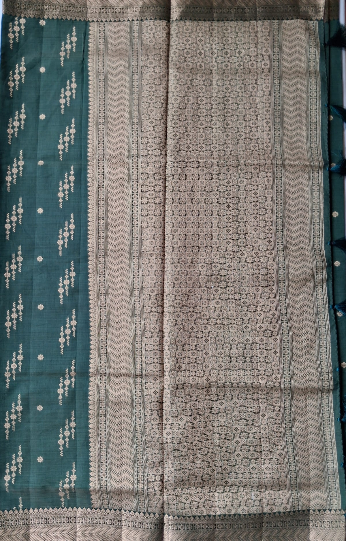 Geometric floral zari pallu on Vanashree Varnam forest green semi-tussar saree