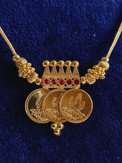 Three Coin Lakshmi Pendant Mala close-up – traditional South Indian temple jewellery with three Lakshmi coin pendants, crown-inspired connector and ruby-tone stones