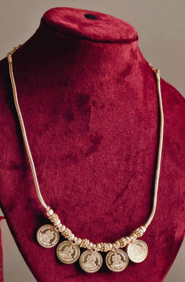 Five Big Coin Lakshmi Pendant Mala – traditional South Indian temple jewellery with five Lakshmi coin pendants displayed on a maroon mannequin
