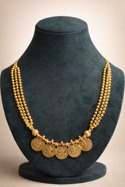 Mid-length Five Lakshmi Coin Kasumala Necklace – traditional South Indian temple jewellery with Lakshmi coin pendants and multi-strand gold-tone bead chain displayed on a mannequin