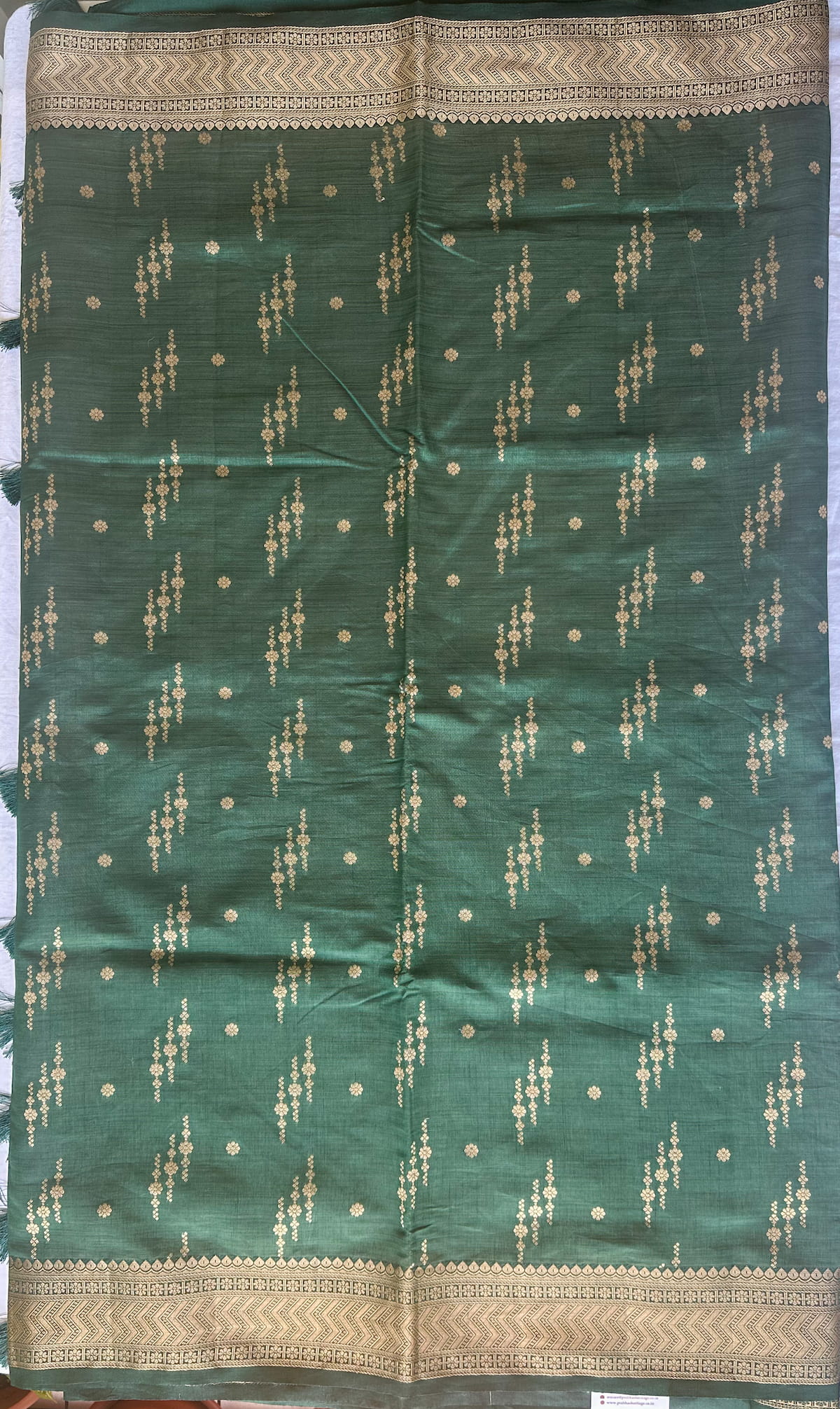 Body detail of Vanashree Varnam forest green semi-tussar saree with antique zari buttas