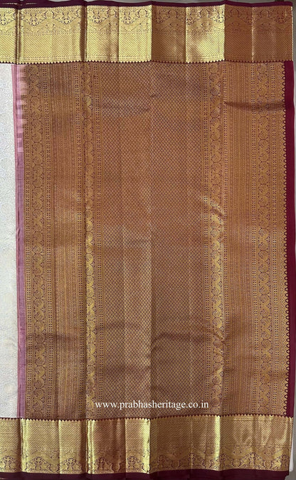 Pallu with a diamond-lattice field and peacock motifs in wine and gold zari