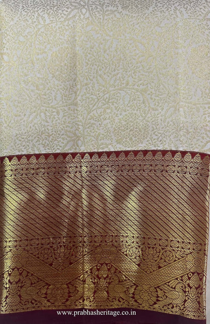 Anandabhairavi Madhura Layam saree folded to show the body and wine Korvai border
