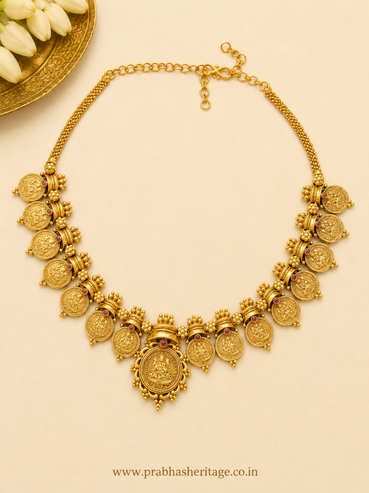 Antique Kasumala with ruby-toned stones shown as a flat lay
