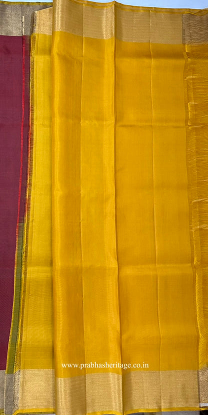 Attached mustard-gold contrast blouse piece with a zari border