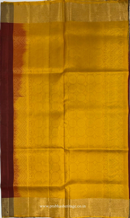 Mustard-gold pallu with a tonal geometric field and decorative side bands