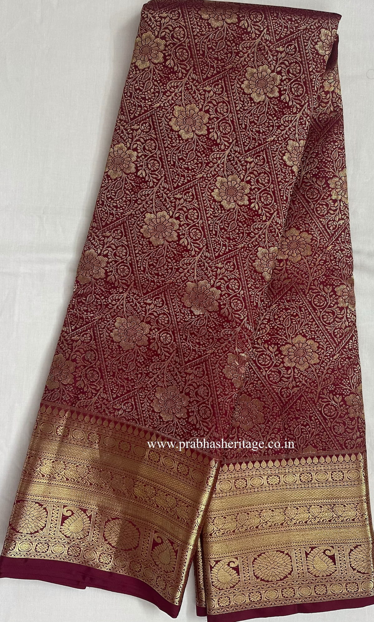 Full length of the saree long-folded, showing the body, border and pallu