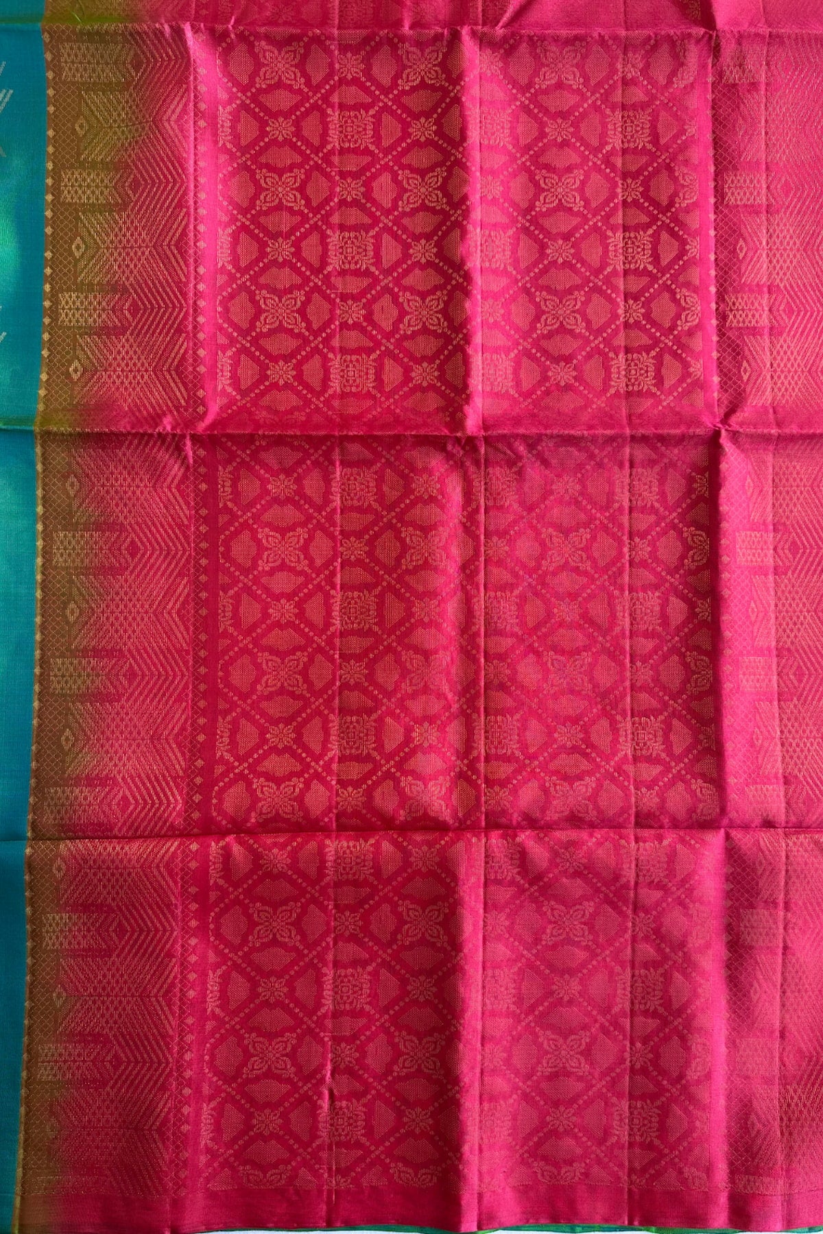 Rani pink pallu richly worked with traditional gold zari motifs
