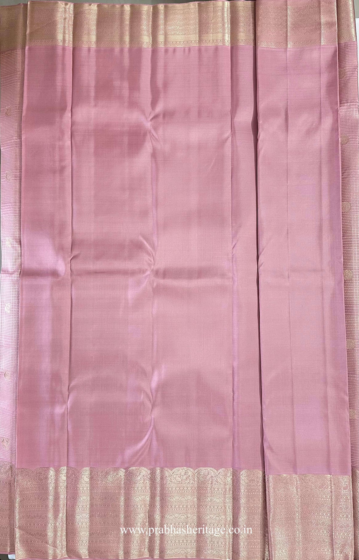 Hamsanandi Swarna Naadam – matching mauve pink blouse piece with plain body and broad coordinated gold zari border.