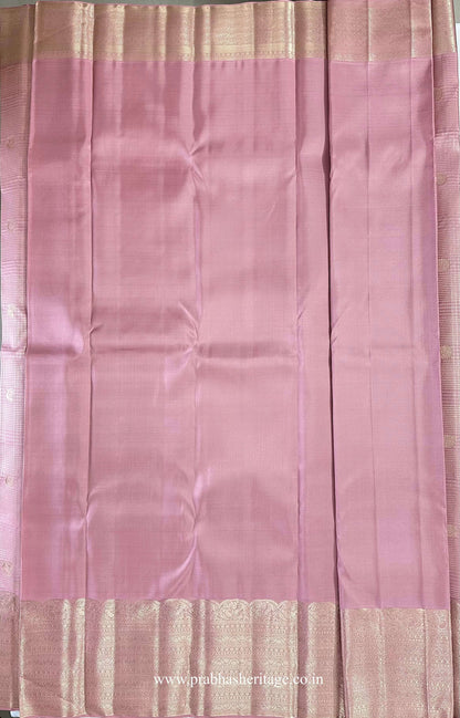 Hamsanandi Swarna Naadam – matching mauve pink blouse piece with plain body and broad coordinated gold zari border.
