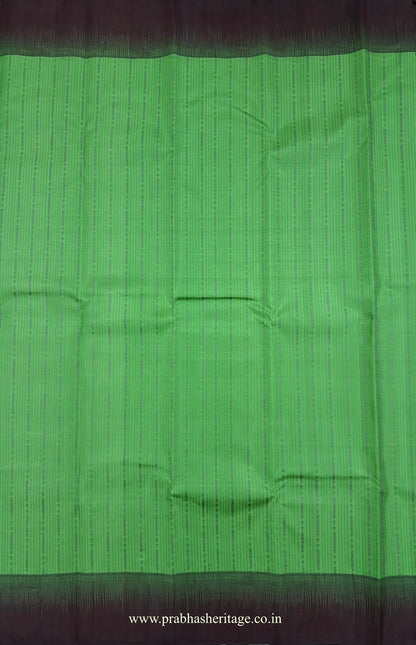 Fine vertical woven lines and ornamental detailing on the parrot-green silk body