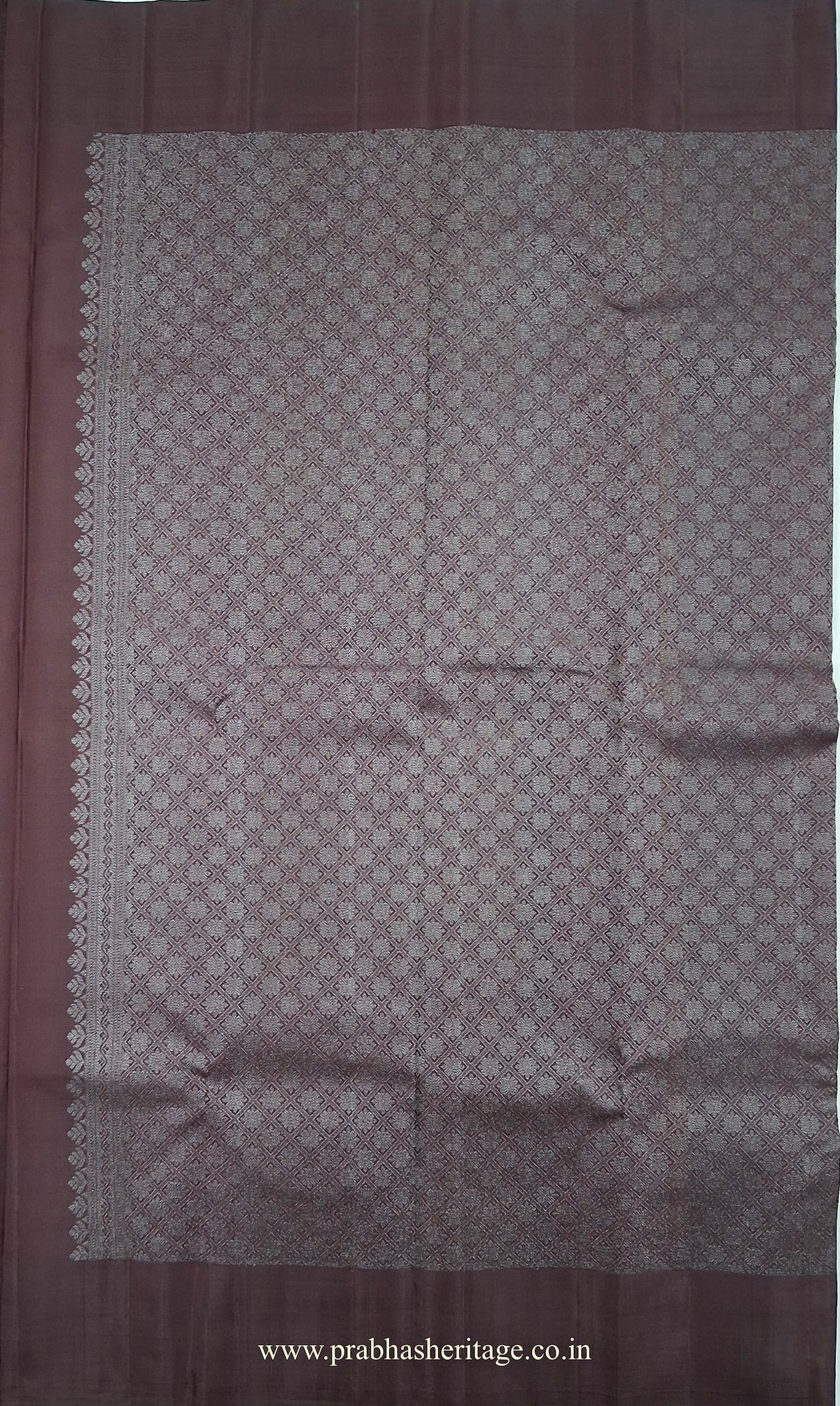 Wine-aubergine pallu with a silver-toned geometric lattice weave