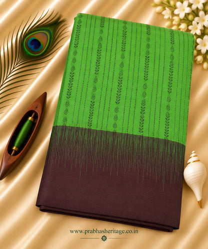 Parrot-green handloom pure soft silk saree with a wine-aubergine Korvai border, portrait