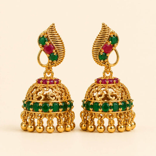 Haritha Varnam Jhimikki display view: emerald-toned stones with ruby-toned accents across the upper section and dome