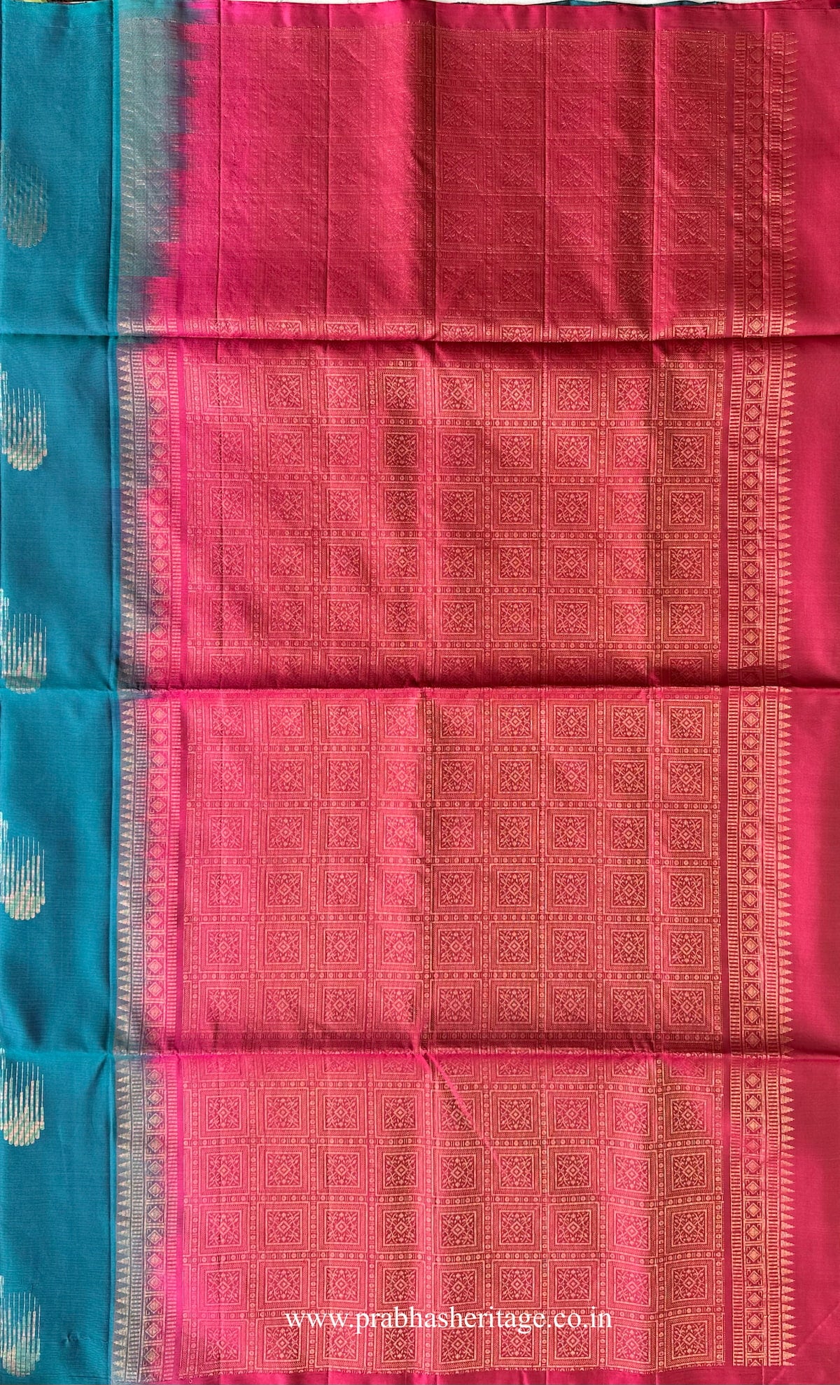 Rani pink pallu with grid-based zari structuring and geometric repeat pattern