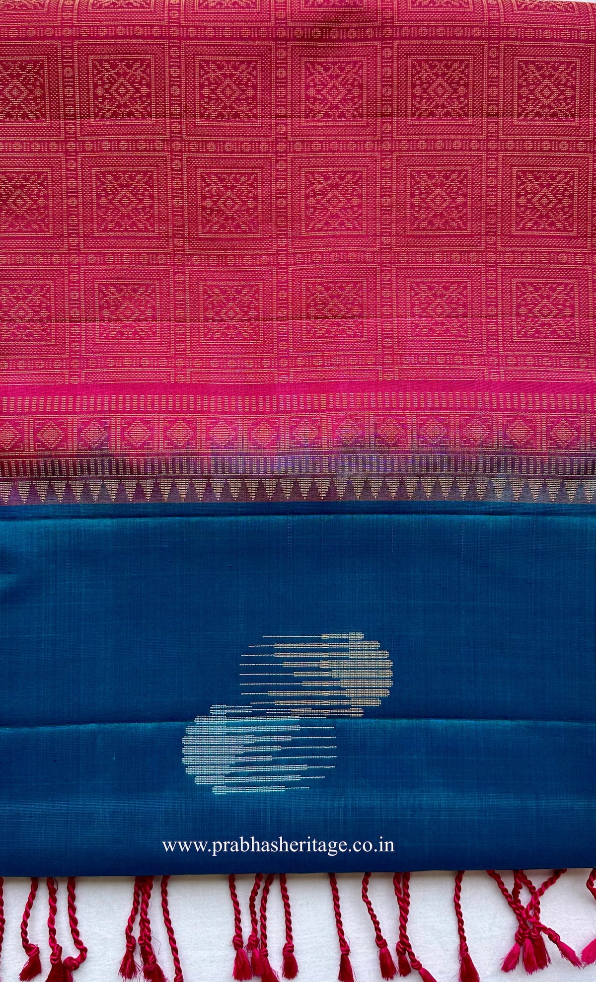 Kalyani Mayil Prabha short-folded to show the borderless peacock blue body