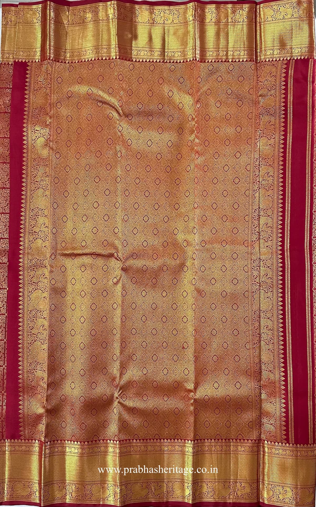 Pallu with dense diamond-patterned zari field and ornamental red-and-gold framing
