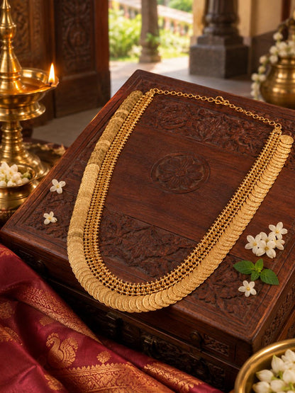 Lakshmi Haram Adukku Kasu Mala styled on a carved heritage wooden jewellery box