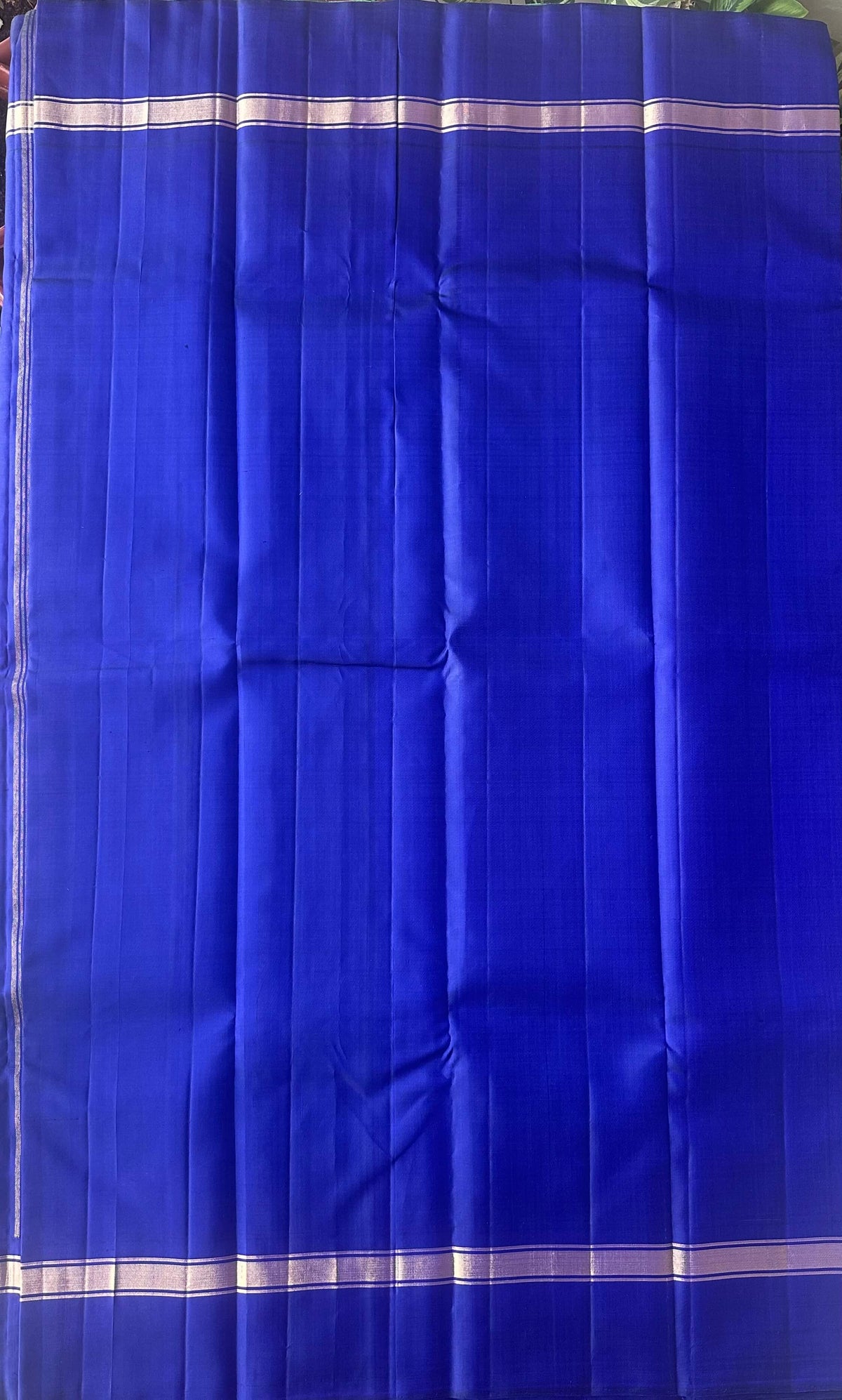 Attached royal blue contrast running blouse with a gold zari border