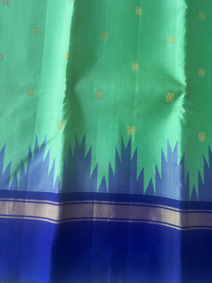 Korvai temple border where the leaf green body meets the royal blue zari border