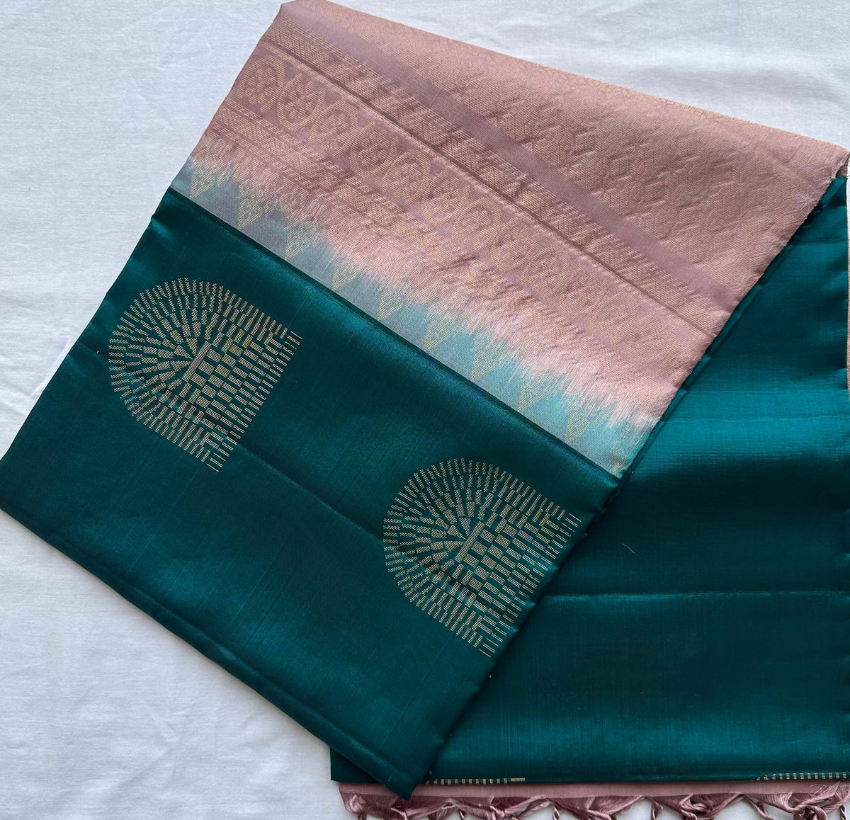 Full length of the saree long-folded, showing the borderless body and pallu