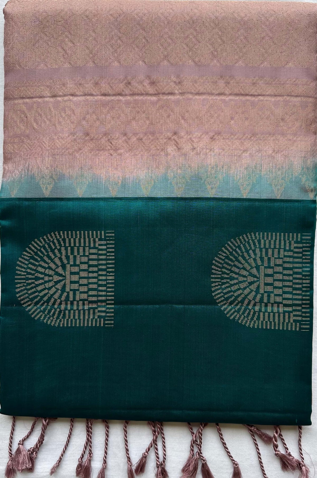 Madhyamavati Mayil Vaibhavam short-folded to show the borderless teal body