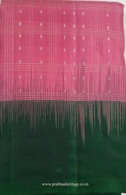 Malar Vana Tarangini short-folded to show the checked body and bottle-green border