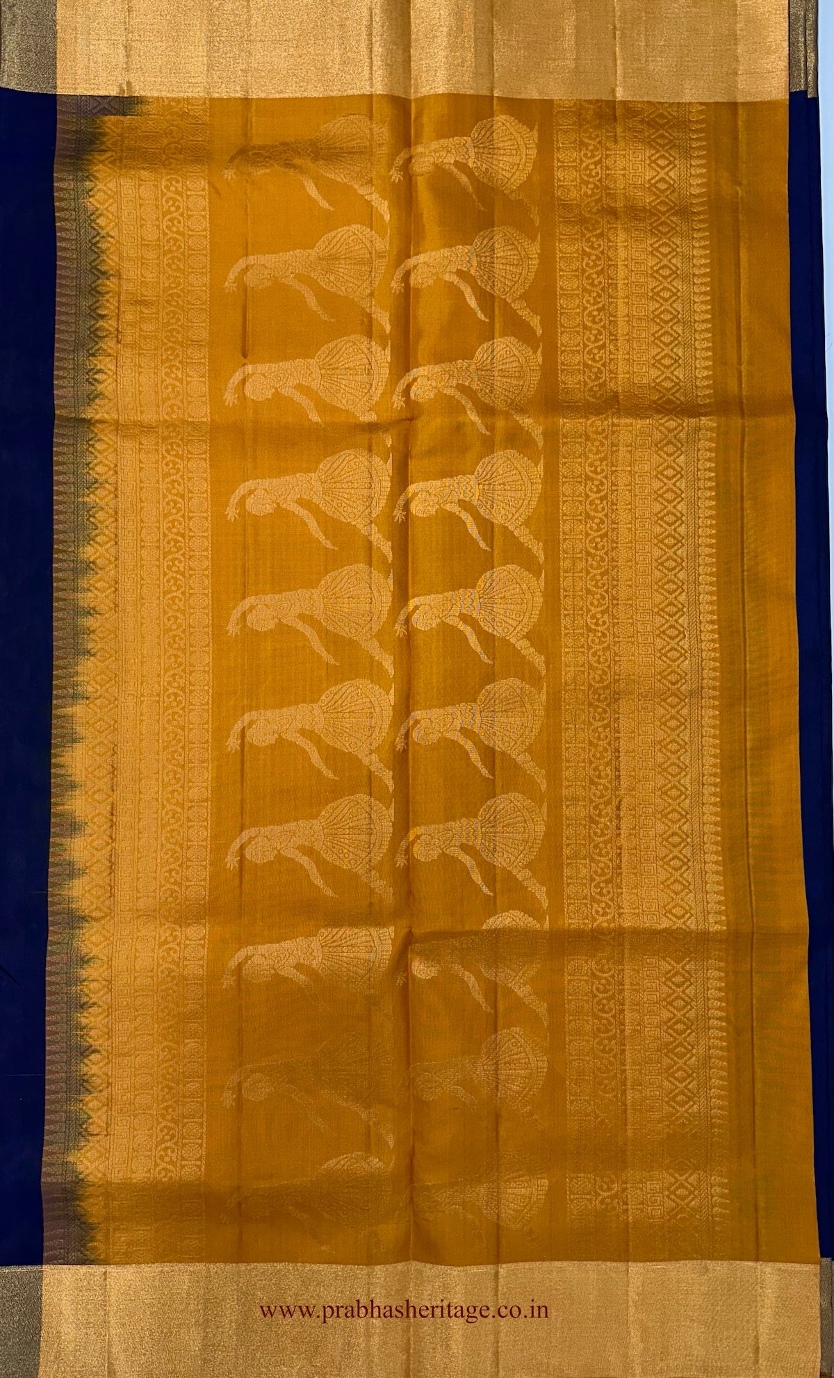 Mustard-gold pallu with dancer figures and patterned zari detailing