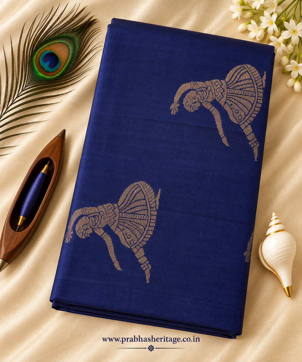 Royal cobalt-blue pure soft silk saree with dancer motifs, portrait