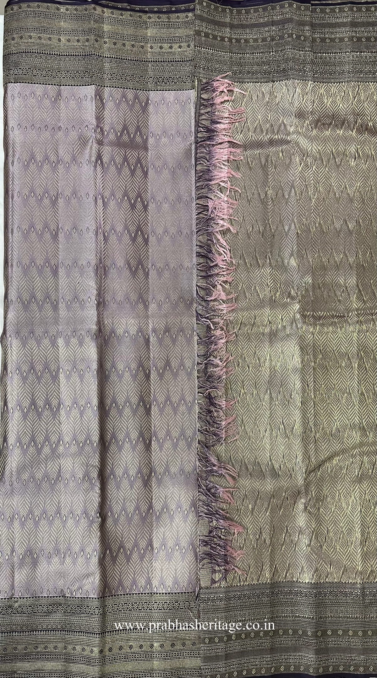 Korvai join where the silvery lavender body meets the deep violet border
