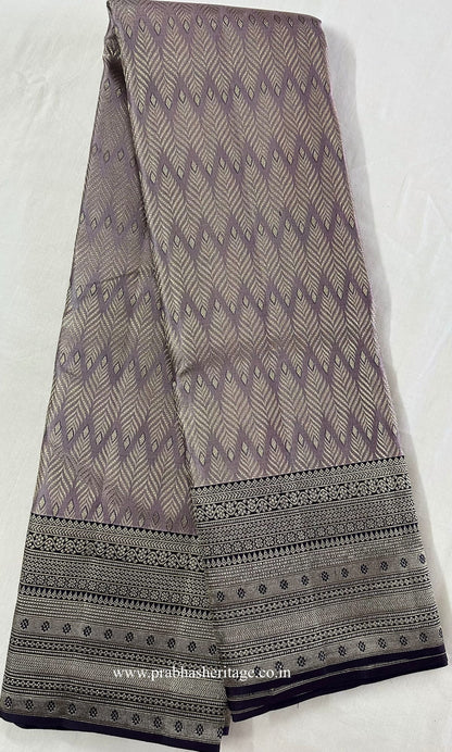 Full length of the saree shown as a long fold, with body, border and pallu visible