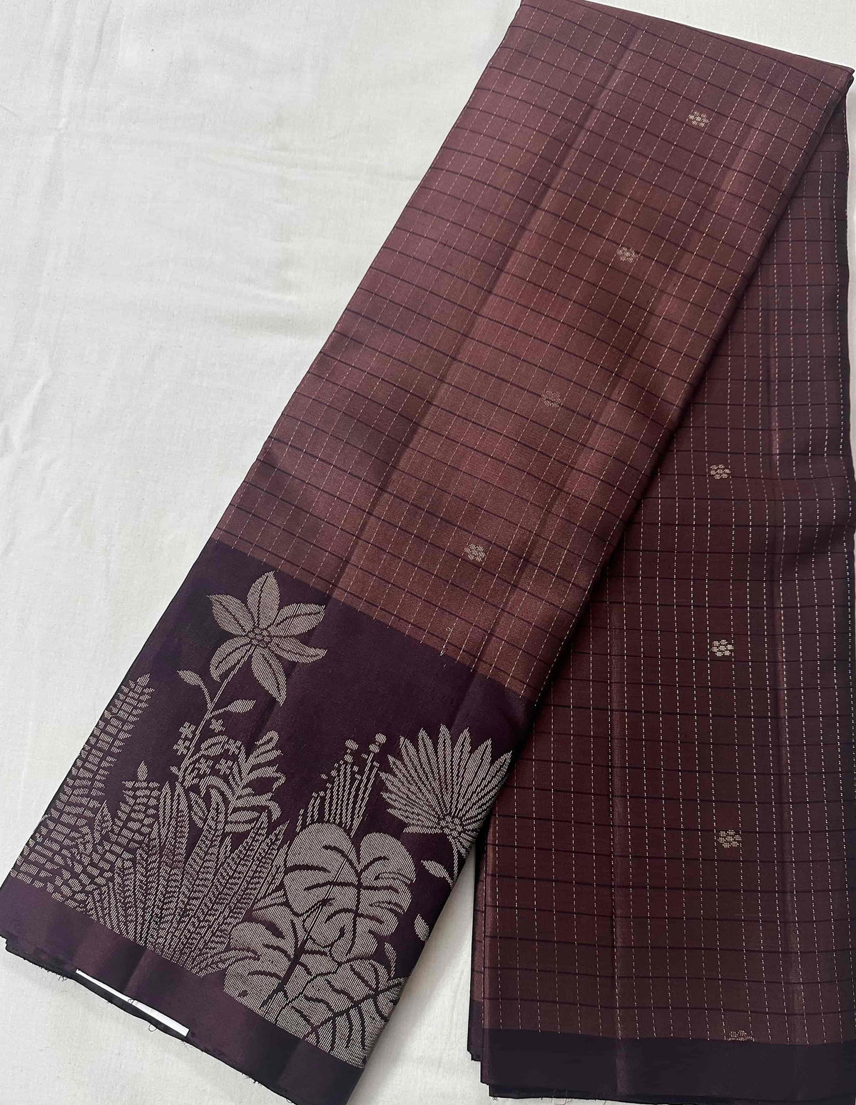 Full length of the rosewood-mauve pure soft silk saree with its botanical aubergine-plum border