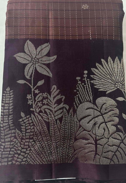Rosewood-mauve pure soft silk saree folded to show the body and aubergine-plum border