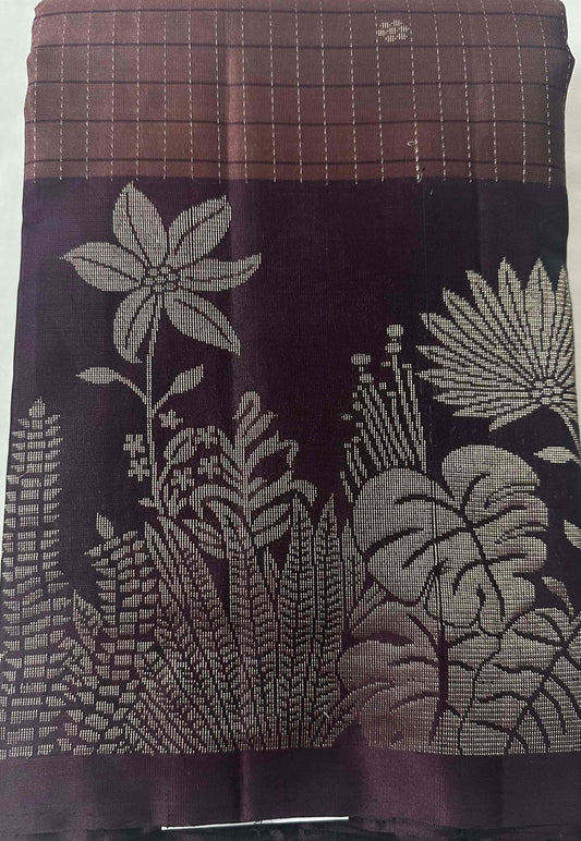 Rosewood-mauve pure soft silk saree folded to show the body and aubergine-plum border