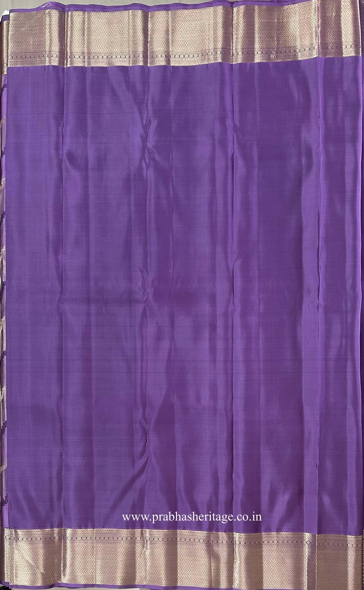Plain lavender-lilac blouse piece with a broad gold zari border