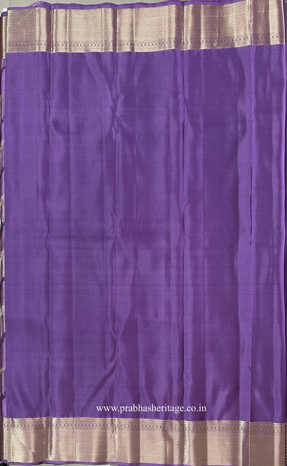 Plain lavender-lilac blouse piece with a broad gold zari border
