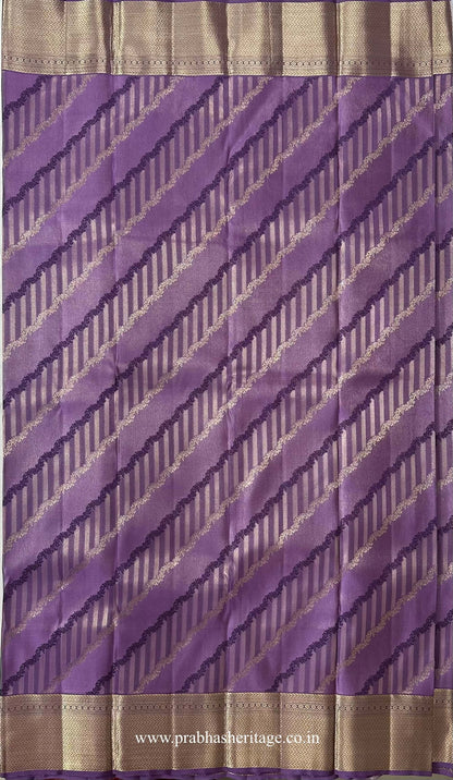 Diagonal botanical and linear weave in purple and gold on the lavender silk body