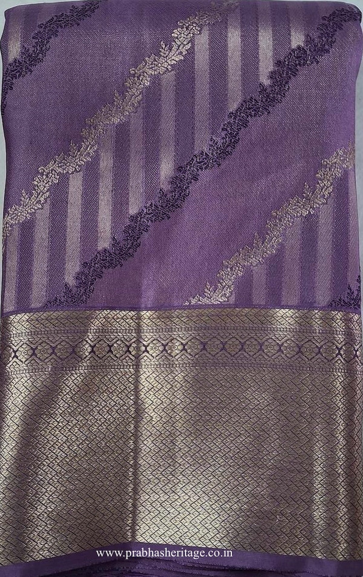 Sahana Lavanya Tharangini short-folded to show the body and gold zari border