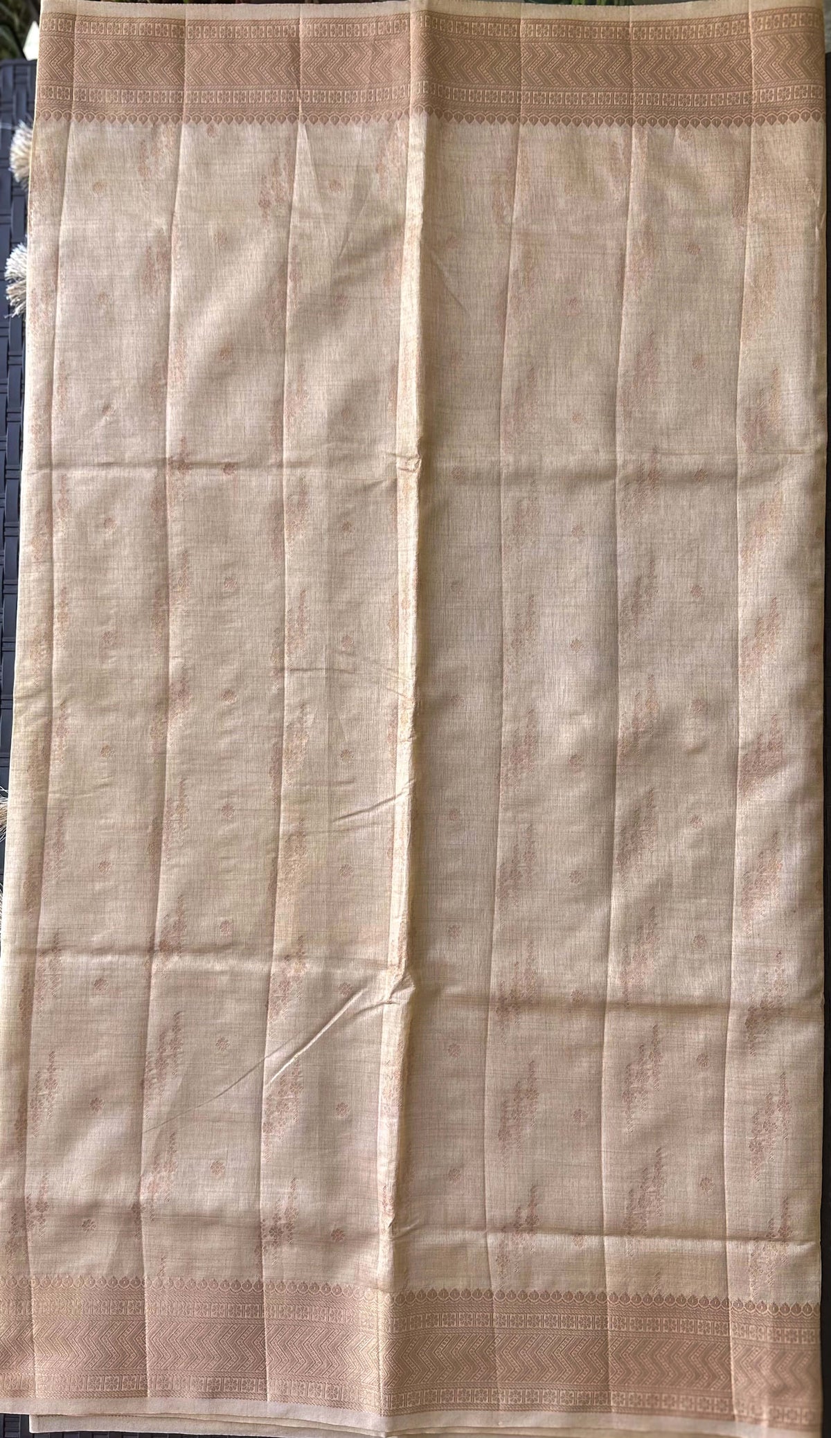 Body detail of Chandana Varnam sand beige semi-tussar saree with champagne-gold zari trails