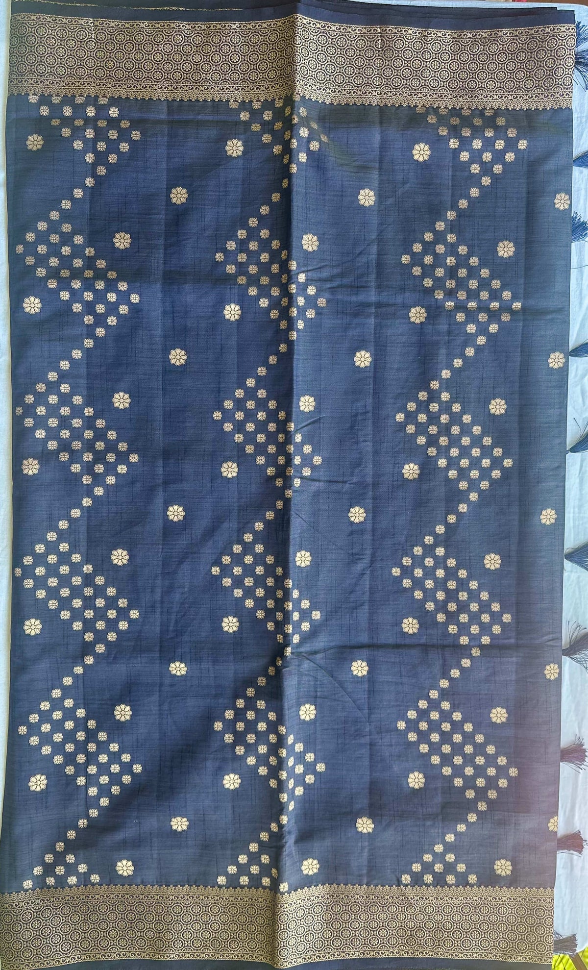 Body detail of Neela Varnam navy blue semi-tussar saree with antique gold zari buttas