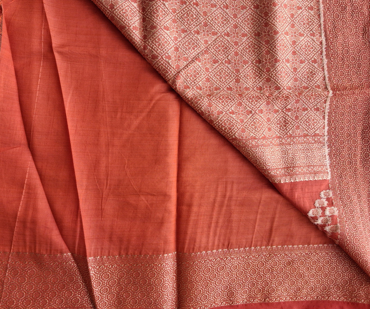 Attached running blouse with zari border on Sengal Varnam brick red semi-tussar saree