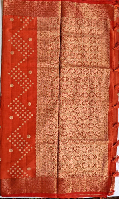 Diamond-pattern zari pallu with tassels on Sengal Varnam brick red semi-tussar saree