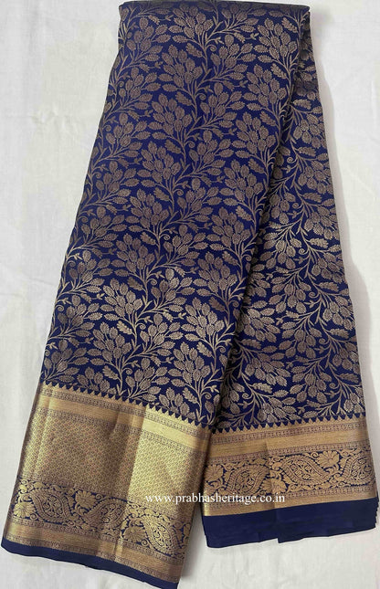 Full length of the navy-blue Kanchipuram silk saree with its gold zari border