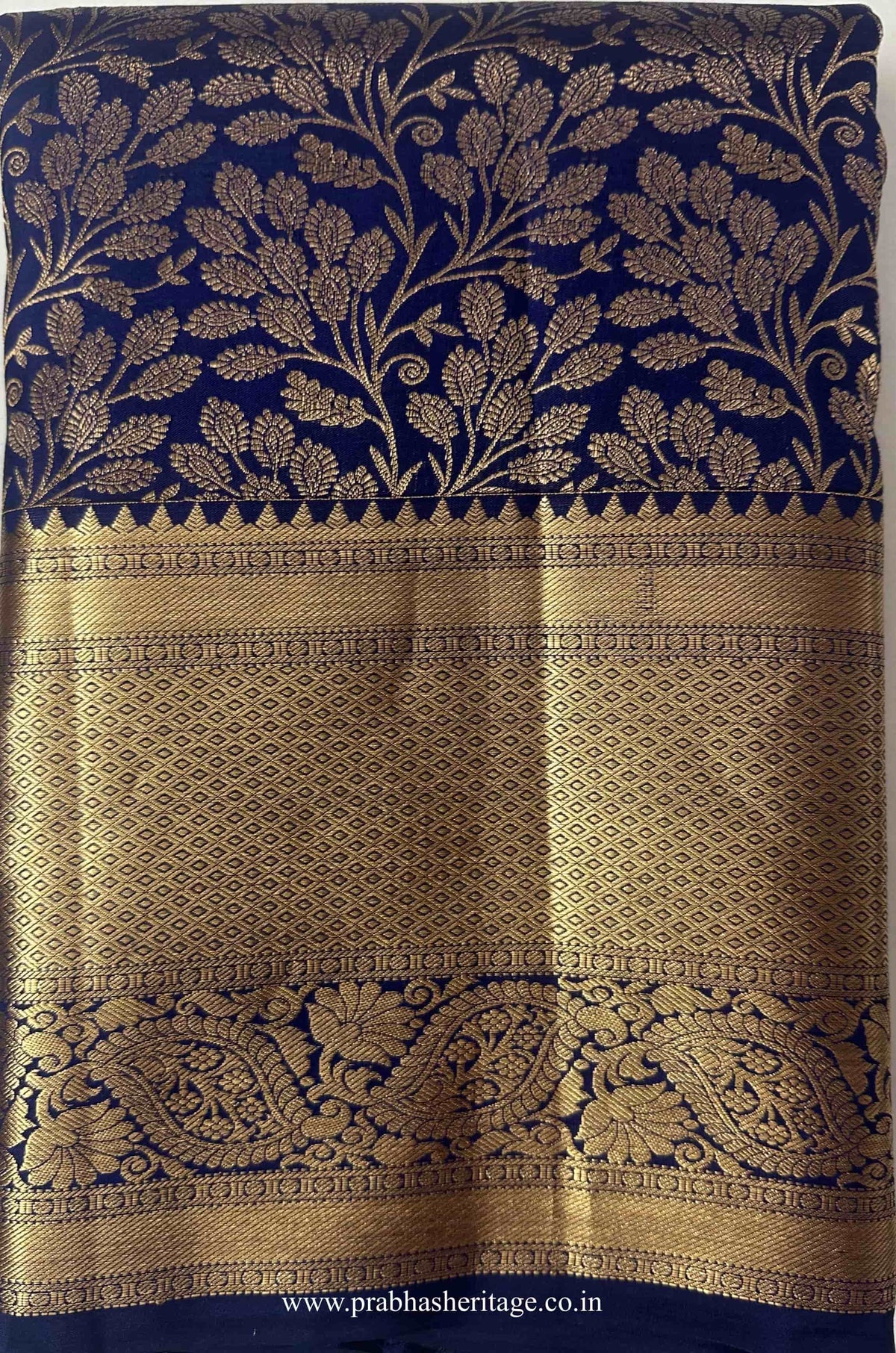 Shankarabharanam Mangala Kanakadhara saree folded to show the body and paisley border