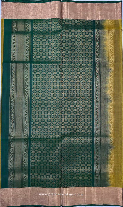 Deep teal-emerald pallu with dense repeating pattern and ornamental bands