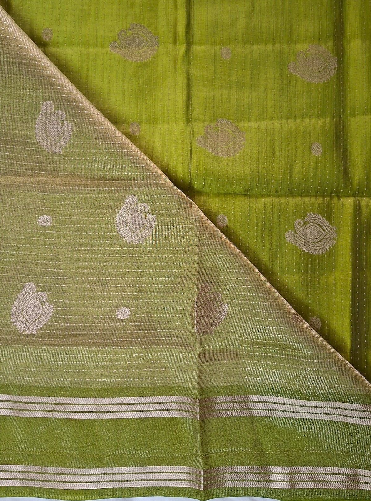 Attached running blouse with zari on Elam Pachai Varnam lime green saree